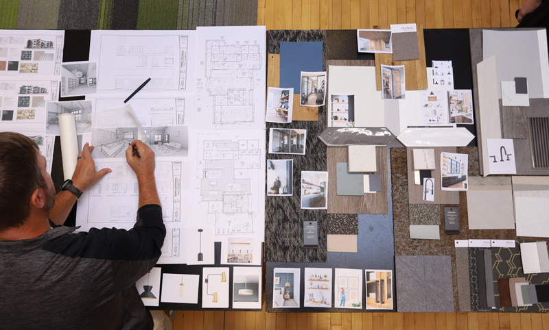 man writing over a table